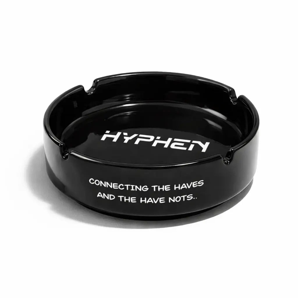 Black ashtray with 'HYPHEN' branding and text on a white background
